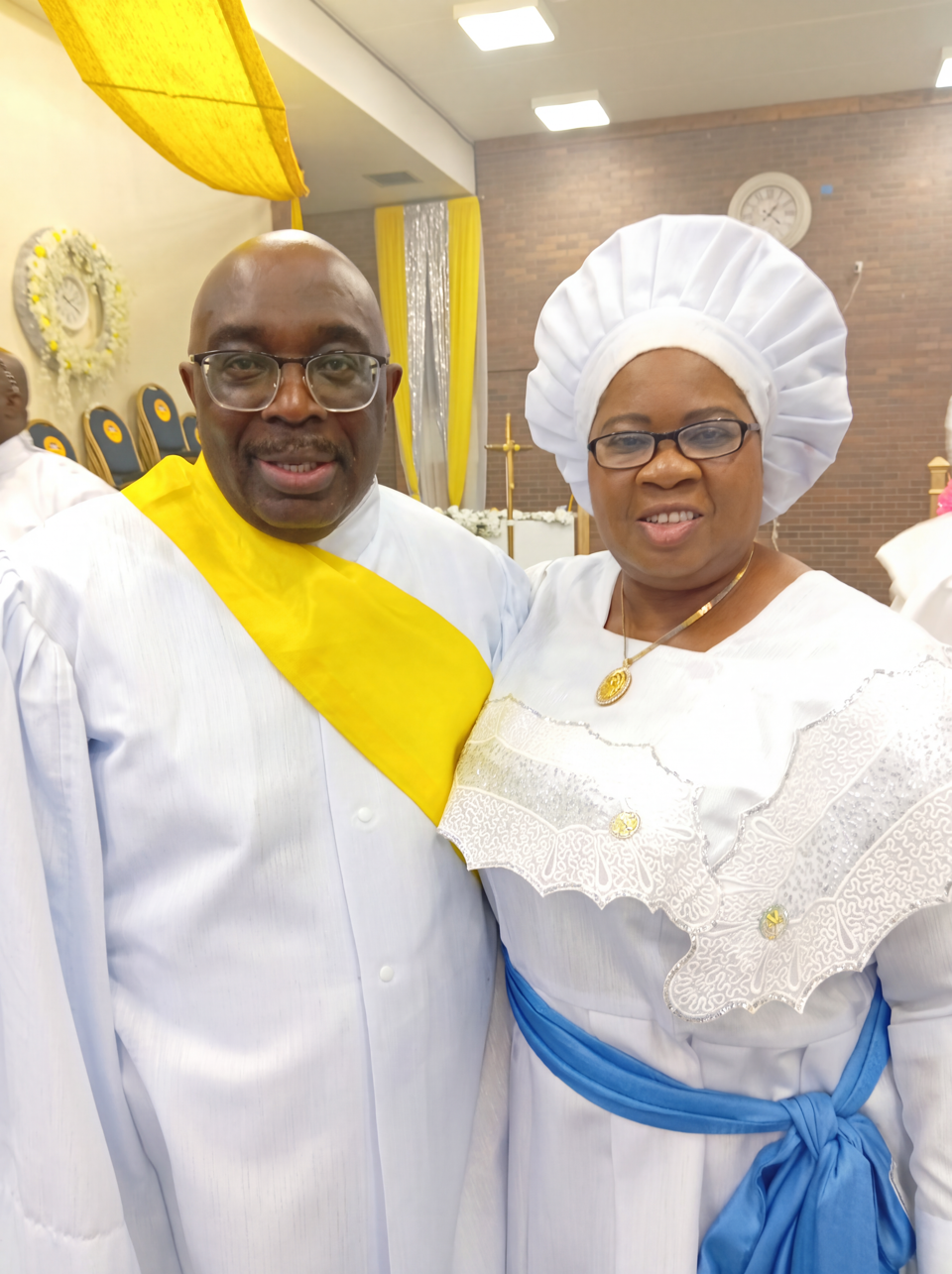 VSE Peter Ilori and Mother Celestial Oluwafunke Oluwatoyin Ilori together inside a church in white garments.